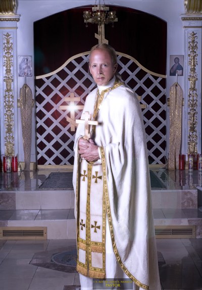 The Very Reverend Father John E. Hamatie in vestments before the iconostasis